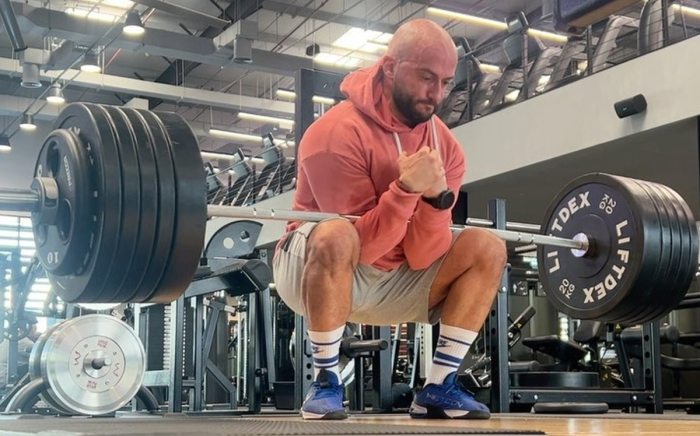 Download Athlete Performing Deadlift | Wallpapers.com Benefits deadlifts you probably never knew